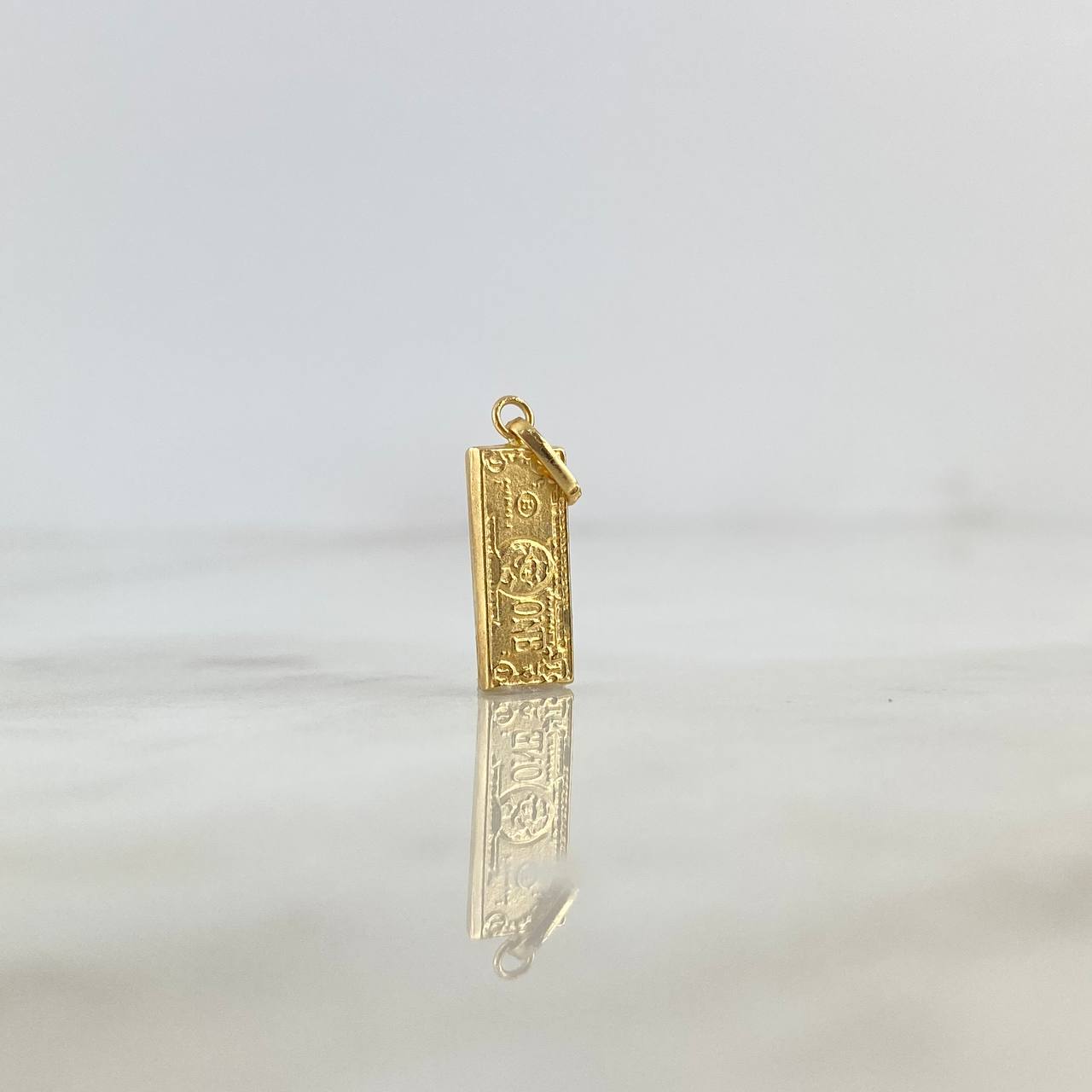 Dije Dólar 0.55gr / 2.2cm / Oro Amarillo ©