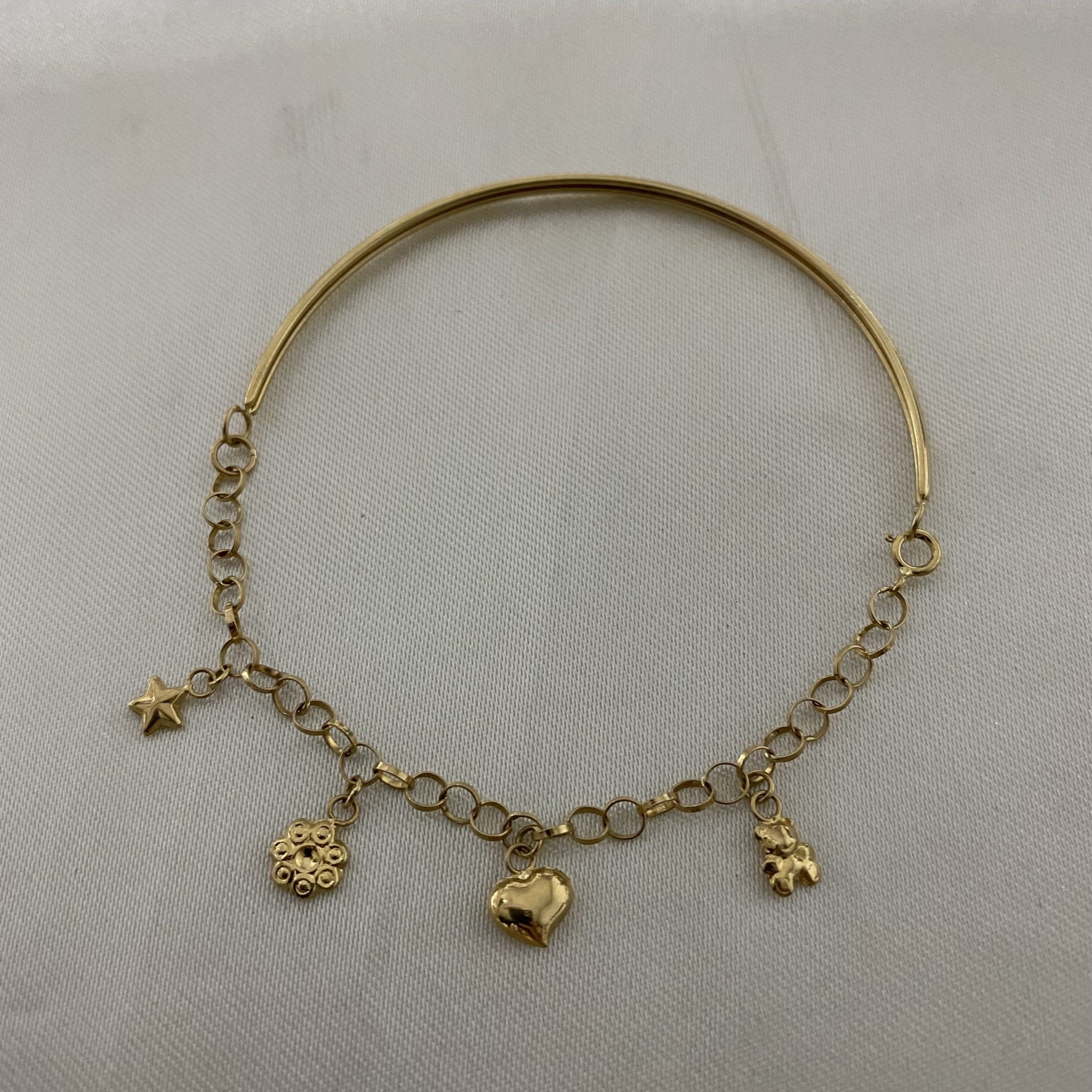 Pulsera Casandra 3.45gr «Estrella-Flor-Corazon-Oso» Oro Amarillo