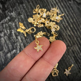 Dije Estrella de Mar 0.45gr/1.5cm Tiny Circones Blancos Oro Amarillo